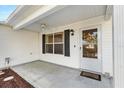 Covered front porch with access to the front door at 1201 De La Fuente Ct, The Villages, FL 32162