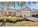 One story house with a large front yard and walkway at 504 Narrow View Ln, Groveland, FL 34736