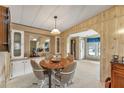 Round dining table with four chairs and built-in hutch at 1435 Mohawk Cir, Tavares, FL 32778