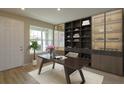 Bright home office features built-in shelving and a large desk at 16436 Hamlin View St, Winter Garden, FL 34787