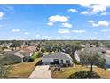 House in a residential neighborhood, aerial view at 2514 Raintree Dr, The Villages, FL 32162