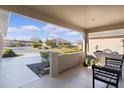 Covered porch with seating, overlooking the neighborhood at 3469 Melbourne Ln, The Villages, FL 32163