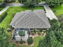 Single-Gathering home with tile roof, screened patio, and landscaped yard at 6147 Spinnaker Loop, Lady Lake, FL 32159