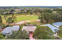 An aerial view of the home, pool, and the golf course community at 5509 Grove Mnr, Lady Lake, FL 32159