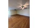 Living room with light walls and wood-look floors at 926 Willow Dr, Leesburg, FL 34748