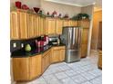 Spacious kitchen with stainless steel appliances and dark countertops at 1270 Addison Ave, The Villages, FL 32162