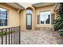 Inviting front entry with a paved patio and attractive landscaping at 39539 Harbor Hills Blvd, Lady Lake, FL 32159