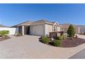 House exterior showcasing landscaping and driveway at 9189 Se 167Th Dandrea Pl, The Villages, FL 32162