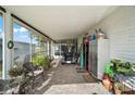 Spacious Florida room with a golf cart and ample seating at 1715 Lilly Ln, Lady Lake, FL 32159