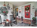 Welcoming front porch with charming decor at 1715 Lilly Ln, Lady Lake, FL 32159