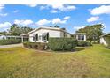 Inviting front yard with well-maintained landscaping and a welcoming walkway at 1715 Lilly Ln, Lady Lake, FL 32159