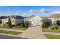 Well-maintained landscaping surrounds this lovely home at 5300 Sunshine Dr, Wildwood, FL 34785