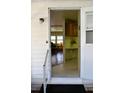 Front entrance with view into living room and kitchen at 101 Mango Cv, Leesburg, FL 34748