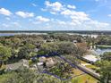 Aerial view showcasing home's location on a large lot near the lake at 1281 Gray Ct, Eustis, FL 32726