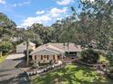 Aerial view of a ranch home with a large lot and detached garage at 1281 Gray Ct, Eustis, FL 32726