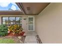 Inviting front entrance with landscaping at 13340 Country Club Dr, Tavares, FL 32778