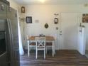 Small kitchen area with a table and chairs, near the refrigerator at 15 Dogwood Trail Ter, Ocala, FL 34472