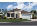 One-story home with a two-car garage and landscaped lawn at 2878 Supermarine Rd, Tavares, FL 32778