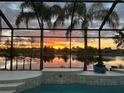 Relaxing pool and patio area with sunset view at 2994 Luraville Rd, The Villages, FL 32163