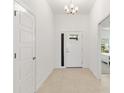 Bright and airy entryway with tile flooring and white doors at 7531 Far Hills Loop, The Villages, FL 34762