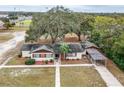 Ranch home with carport and large backyard at 1801 Vine St, Leesburg, FL 34748