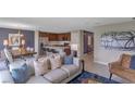 Open living space with modern furniture and kitchen views at 2986 Supermarine Rd, Tavares, FL 32778