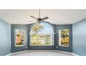 Living room featuring hardwood floors and an arched window with a view at 3141 Britannia Blvd # D, Kissimmee, FL 34747