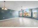 Bright living room with hardwood floors and a large window at 3141 Britannia Blvd # D, Kissimmee, FL 34747