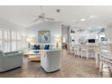 Bright living room features vaulted ceilings, tiled floors, and comfy seating at 17640 Se 81St Timberwood Ter, The Villages, FL 32162