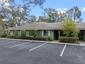 Green house exterior with parking and landscaping at 636 Mount Homer Rd # 636, Eustis, FL 32726