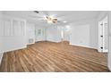 Spacious living area with wood-look flooring at 77 Aberdeen Cir # 77A, Leesburg, FL 34788