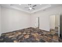 Spacious bedroom with tile flooring and ceiling fan at 5891 Sw 138Th Ter, Ocala, FL 34481