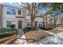 Front view of townhome with landscaping and walkway at 4904 Sw 45Th St, Ocala, FL 34474