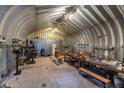 Spacious workshop with various tools and workbenches at 12359 Ne Highway 314, Silver Springs, FL 34488