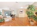 Spacious living room with hardwood floors and ample natural light at 8033 Sw 81St Loop, Ocala, FL 34476