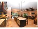 Spacious kitchen boasts granite countertops, stainless steel appliances, and an island at 14950 Nw 216Th Pl, Micanopy, FL 32667
