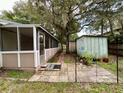 Home features a screened porch and patio area at 14468 Ne 204Th Ln, Fort Mc Coy, FL 32134