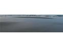Serene beach view featuring soft sand and ocean waves at 2625 S Atlantic Ave # 9Ne, Daytona Beach, FL 32118
