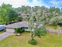 Single story home on large lot with mature trees at 19831 Sw Nightingale Dr, Dunnellon, FL 34431