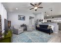 Bright and airy living room with comfy seating and a large TV at 1658 Ne 162Nd Pl, Citra, FL 32113