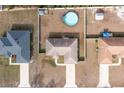 An aerial view of the home and fenced backyard, featuring an above-ground pool at 15761 Sw 23Rd Avenue Rd, Ocala, FL 34473