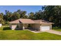 Single-story home with a large backyard and a tranquil setting at 13589 Se 100Th Ave, Belleview, FL 34420