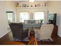 Living room with tile floors and comfy seating at 948 Old Cutler Rd, Lake Wales, FL 33898