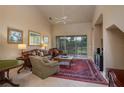 Spacious living room with vaulted ceiling, fireplace, and access to a patio at 3017 Mission Lakes Dr, Lakeland, FL 33803