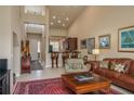 Open living room and kitchen with high ceilings and area rug at 3017 Mission Lakes Dr, Lakeland, FL 33803