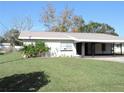 White single story home with carport at 5016 Washington St, Lake Wales, FL 33859