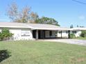 White single story home with carport at 5016 Washington St, Lake Wales, FL 33859