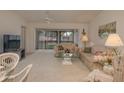 Spacious living room with comfortable furniture and access to a lanai at 8203 Village Dr # 8203, Lake Wales, FL 33898