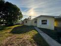 Front view of a yellow house with walkway at 1815 Moose Dr, Lakeland, FL 33801