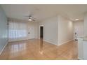 Bright living room with wood-look tile floors and a ceiling fan at 5011 Hemingway Cir # 5011, Haines City, FL 33844